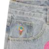 Jeanshose mit „Running Dog“-Motiv und doppeltem Bund